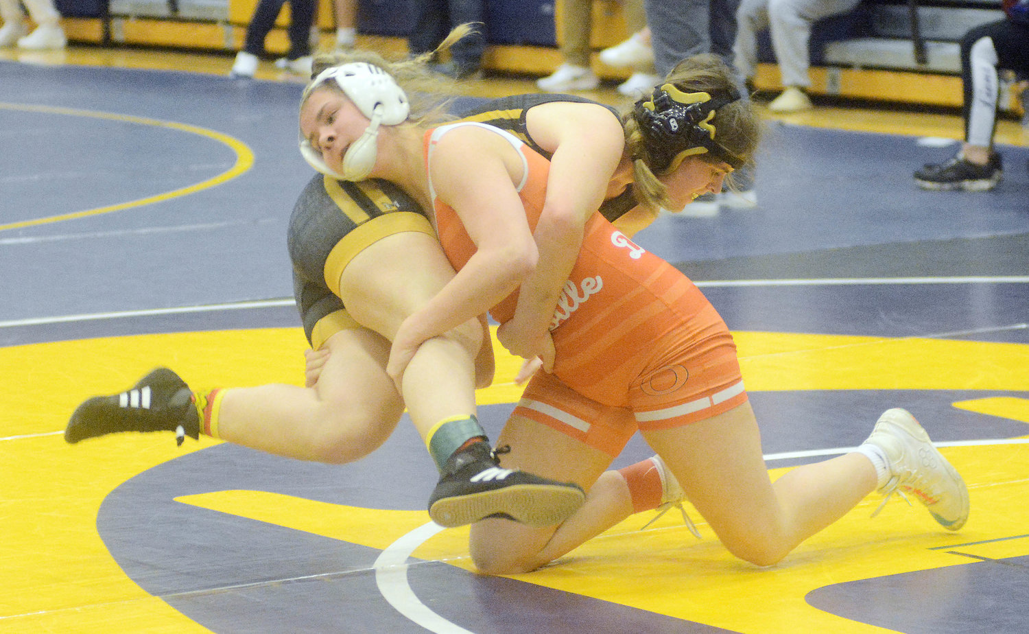 McKenzy Echols (right) takes down Lafayette’s (Wildwood) Mya Anspach during their first-round bout at 145 pounds.